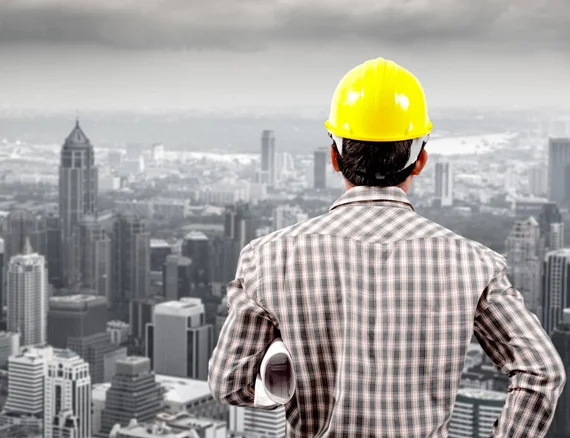 Engineer overlooking city